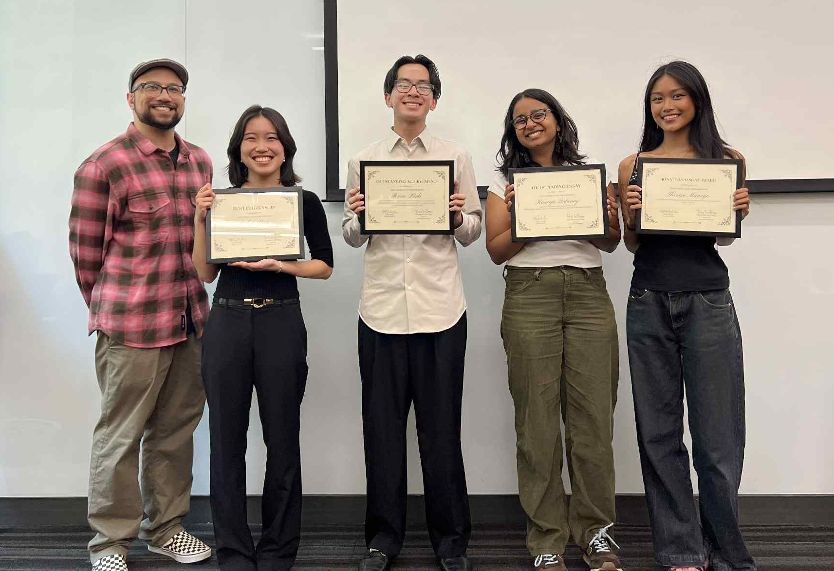2026 graduates with their awards and the DUS