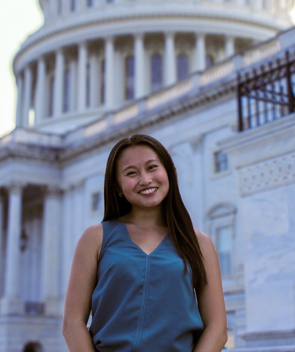 Grace Herzog, a young Asian woman with brown hair smiling